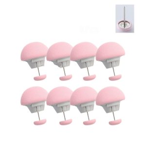 Eight pink makeup sponge holders arranged in a row, each with a white base and a metal pin.