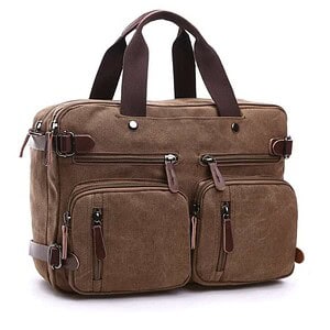Canvas travel bag with multiple zippered compartments and leather accents for durability and style.