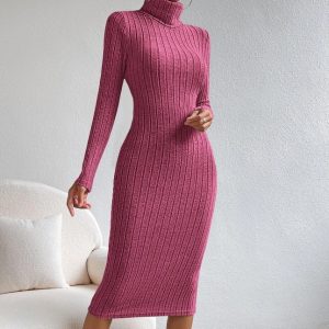 Soft pink ribbed knit turtleneck midi dress, stylish and comfortable for fall and winter fashion. Perfect for casual outings or elegant events, showcasing classic knitwear elegance.