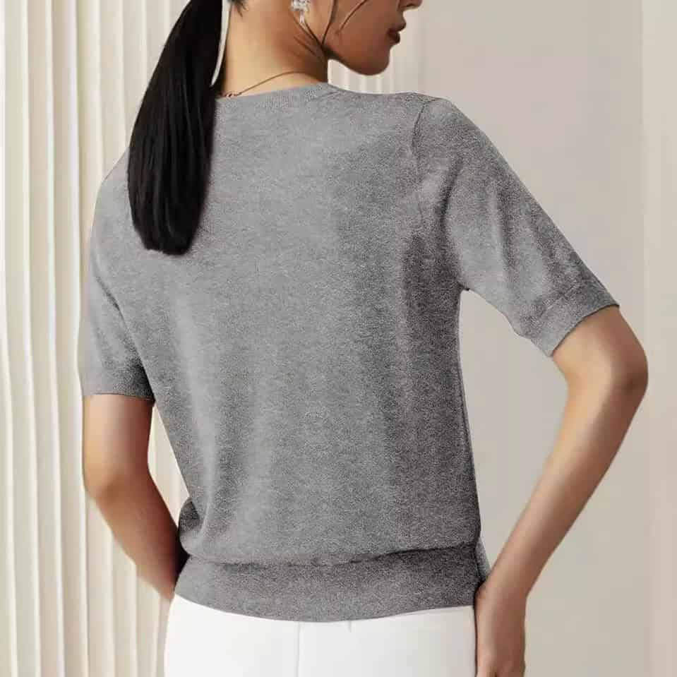 Solid Color French Short Sleeve Sweater - Simple Round Neck Charm 5 Back View Of A Woman Wearing A Gray Short-Sleeve Sweater With A Fitted Design.
