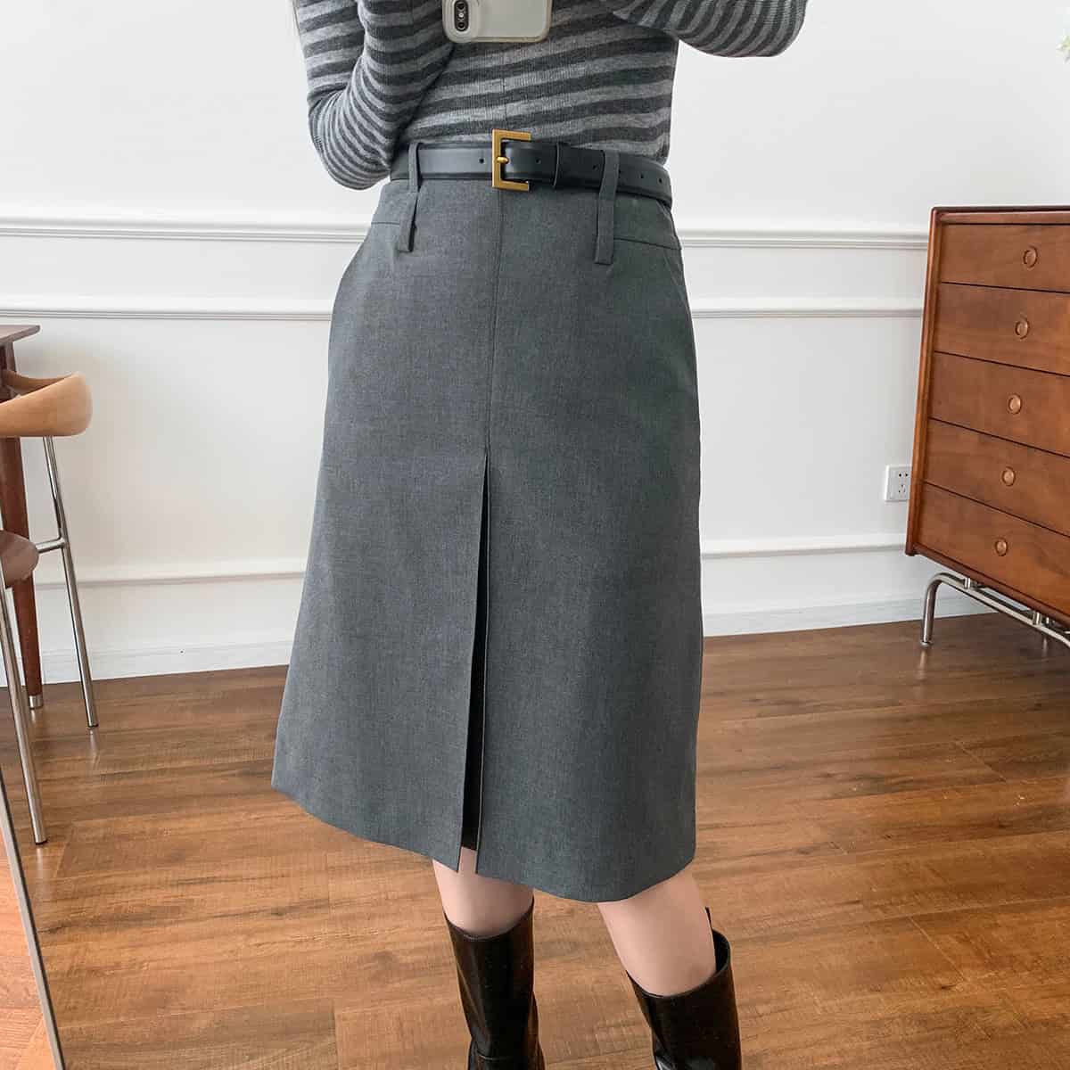 Classic Gray Worsted A-Line Skirt for Women - Perfect Business Wear 2 Elegant Gray Wide-Leg Skirt With Front Slit, Paired With A Striped Top And Black Belt, Stylishly Showcased Indoors For Professional Or Casual Fashion Looks.