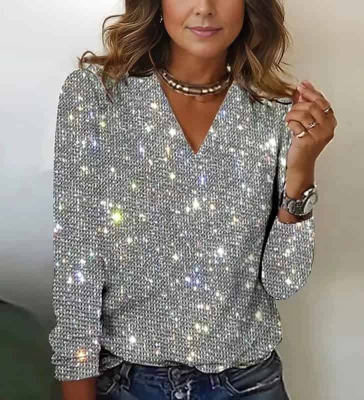 Chic Women's Digital Print Round Neck Long Sleeve Tee - Stylish Comfort, All Day 2 Woman Wearing A Silver Sweater With A Sparkling, Glittery Texture And A V-Neck Design.
