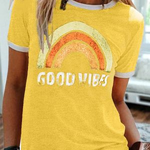 Yellow T-Shirt Featuring A Rainbow Graphic And The Text 'Good Vibes' In White.