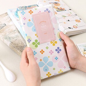 Cute floral mini album for scrapbook or photo storage, colorful flower design, ideal for craft projects, personalized gift, or memory book, premium quality materials, stylish and functional photo album.
