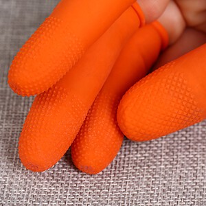 Bright orange silicone cleaning gloves with textured fingertips for enhanced grip and effective cleaning. Perfect for household chores, kitchen, and surface cleaning needs.