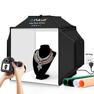 Puluz photo soft box with a necklace display and colored backdrops for photography.