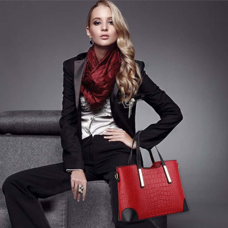 Vintage Crocodile Pattern Shoulder Bag: 2 in 1 Messenger & Handbag Combo, Leather Wallet 6 Elegant Woman With Blonde Hair Modeling Stylish Black Suit And Red Scarf, Holding A Red Textured Handbag, Showcasing Fashion Accessories Available On Syndmart Online Marketplace.