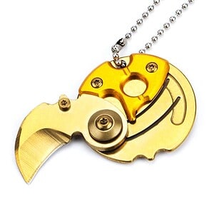 Shark-shaped pocket knife with gold and silver finishes, decorative and functional, compact design for everyday carry and outdoor activities. Perfect as a collectible or gift item.