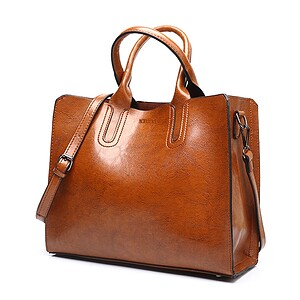 Brown leather handbag with adjustable strap and stylish design, perfect for daily use and fashion accessories. Made from high-quality material for durability and elegance.