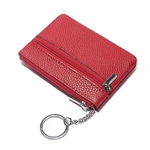 Red leather zippered wallet with keychain attachment, stylish and compact for everyday use, ideal for carrying cash, cards, and keys, perfect accessory for men and women.