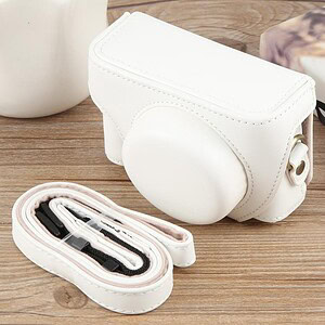 White leather camera bag with adjustable strap and compact storage for photography accessories, perfect for stylish photographers.